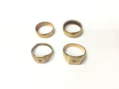 Four 9ct gold rings