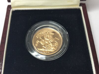 A 1994 gold proof sovereign.