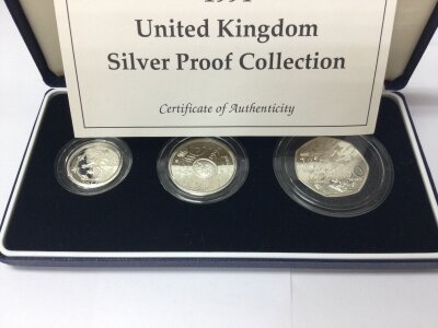 A 1994 United Kingdom silver three coin proof collection.