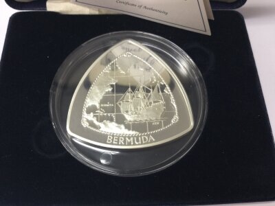 A 1998 silver Bermuda Triangle 9 dollar coin