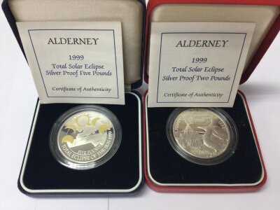 Two silver proof Alderney solar eclipse coins.