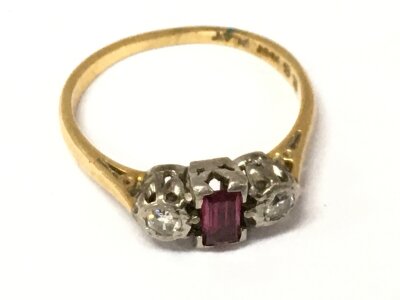 An 18ct gold and platinum ring set with ruby and diamond stones. Size L/M. 2.9g