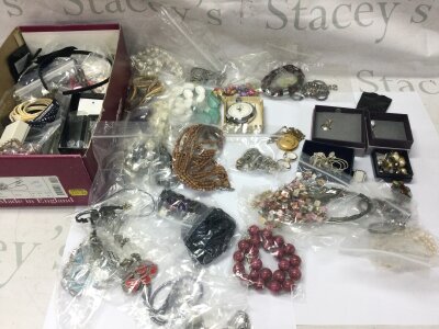 A box of assorted costume jewellery including necklaces rings etc.