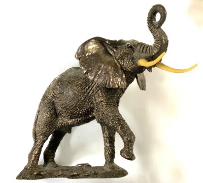 A sterling silver coated resin figure of an African elephant. 19.5cm x 20cm