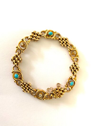A good quality 15ct gold Edwardian bracelet inset with old brilliant cut diamonds and turquoise stones.