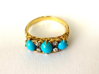 An 18ct gold turquoise and diamond set ring.