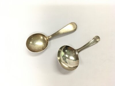 Two silver caddy spoons including a Georgian example.