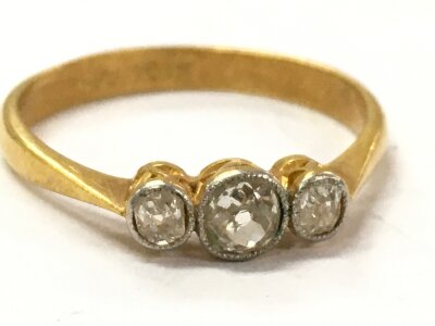 A three stone 18ct gold and platinum ring. Size M. 2.1g