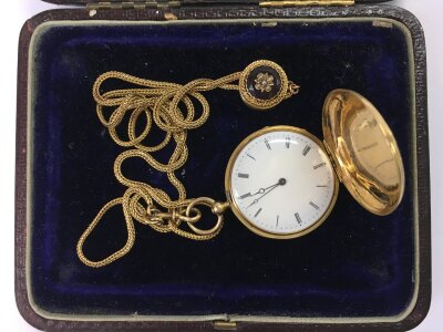 A gold cased fob watch, chain and fob.