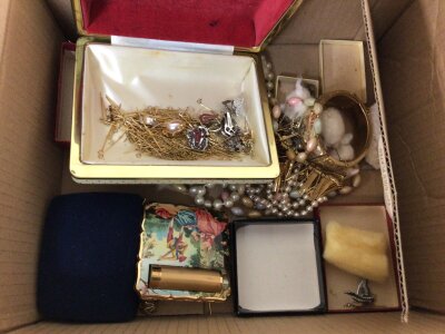 A box containing costume jewellery including a designer ladies compact.