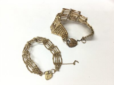 Two 9ct gold gate bracelet both with heart shaped padlocks.
25.72g