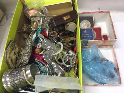 A large collection of assorted costume jewellery including some commemorative coinage.