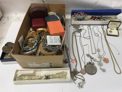 A large collection of assorted costume jewellery including silver items.
