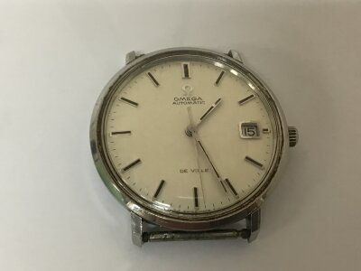 A Vintage Gents Omega Automatic watch De Ville, seen working hand adjustment needs attention no strap numbered to the back 166033 Tool 106.