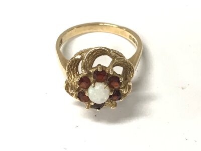A 9ct gold Opal and garnet ring. Size N and 3.87g