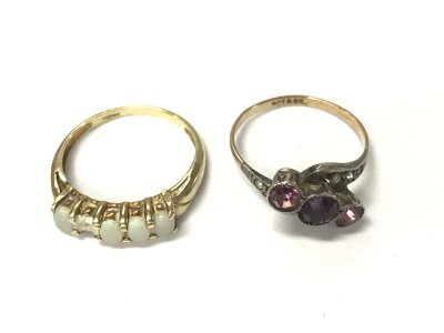Two rings including a 9ct Opal ring and a 9ct and silver amethyst ring. 3.86g