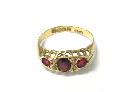 An 18ct gold garnet set ring
Size L and 1.72g