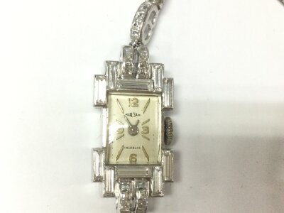 A vintage platinum ladies watch set with diamonds.
12.3mm by 23mm case. 20.16g