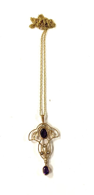 A 9ct gold art Noveau style amethyst and seed pearl pendant and chain.