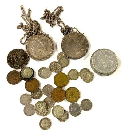 A mixed lot of coins age to include pre 1947 coinage and 2 American Silver Morgan dollars, 1882/1885.
