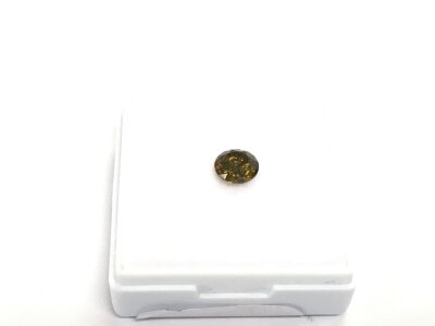 A single unmounted brown/orange diamond. RBC diamond approx 0.71ct.