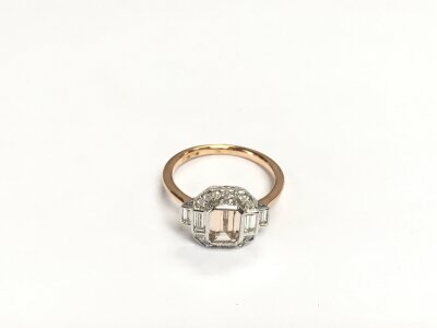 A 9ct rose and white gold Art Deco style ring set with a step cut morganite and RBC and baguette cut diamonds. Morganite approx 0.86ct and diamonds approx 0.40ct. Approx 3.2g and approx M-N.