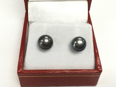 A pair of 9ct gold oblate spheroid iridescent dark pearl studs.