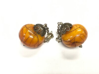 A pair of large amber earrings, approx width 3pm.
