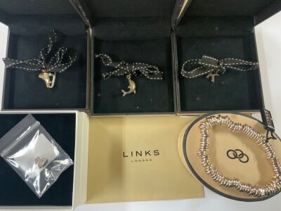 A Links of London sterling silver bracelet with 3 sterling silver charms, together with 1 Sterling silver pandora charm.