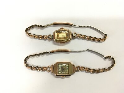 Two gold cased ladies watches, straps not gold.