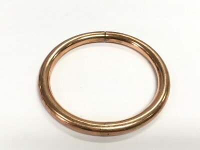 An unmarked rose gold bangle, approx 20g.