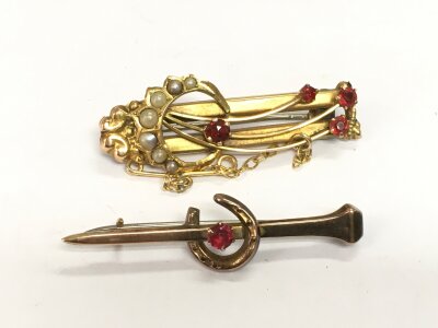 A 9ct gold brooch set with seed pearls and red stones plus one other, total approx 5.5g.