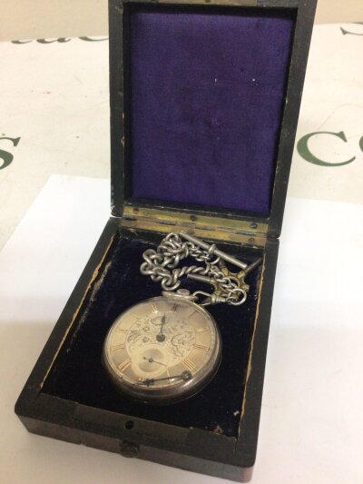 A Silver cased Key wind pocket watch with an engraved silver dial maker Humphries Bilston and attached silver watch chain. In a fitted box.c