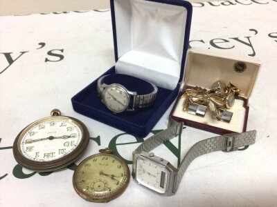 A collection of watches vintage manual wind watch seen working a Casio quartz digital display a travelling clock a button wind pocket watch and a quantity of cufflinks.