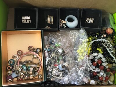 A collection of Silver and white metal items including Pandora bracelets and beads, silver Rings, necklaces etc