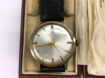 A gold cased Juvenia watch.