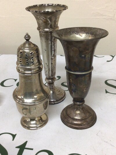 A Silver sugar casters Birmingham hallmarks, one silver vase with loaded base and one silver plated vase (3)
