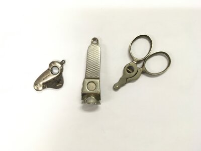 Three cigar cutters.