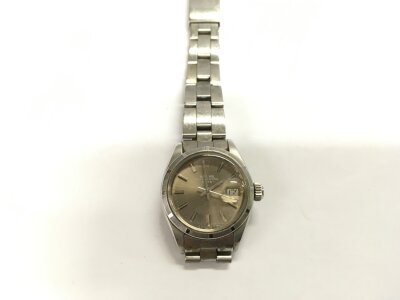 A ladies Rolex watch in a chrome finish with baton numerals. No box or papers.