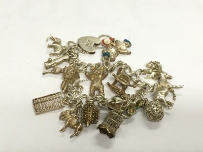 A silver charm bracelet.