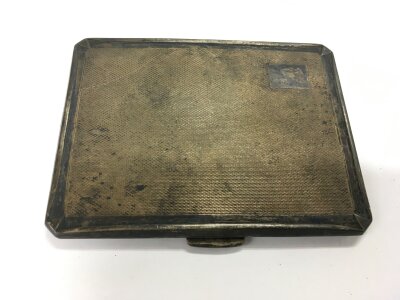 A silver cigarette case, Birmingham hallmarks.