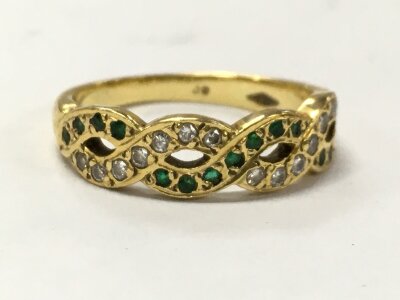 A 9ct gold twisted eternity ring set with gemstones, size L, 3.4g