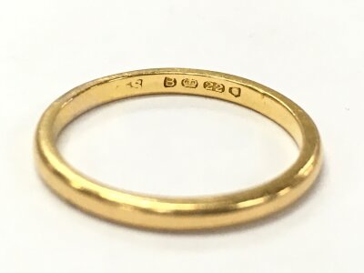 A 22ct gold wedding band, size K. 2.1g total weight