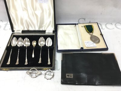 A silver cornered wallet, hallmarked 1950. Territorial Efficiency medal 6001773 SJT.T.LODGE. 5 essex r. Two miniature silver photo frames. Silver hallmarked Chester tea spoons