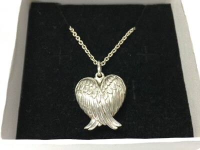 A silver wings locket and chain