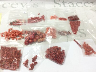 A collection of coral mostly loose beads branch coral and other ones