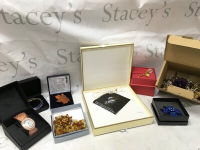 A large collection of costume jewellery including necklaces, brooches, watches etc