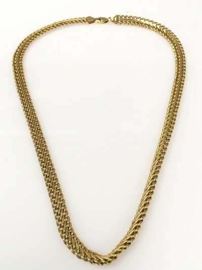 A 9ct gold necklace. 17cm long. 11.8g