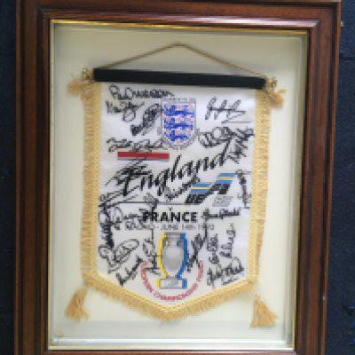 1992 England Squad Signed Euro 92 Football Pennant: Player issue v France in Sweden large quality pennant issued to Paul Merson for the match on 14 6 1992 in Malmo. Signed clearly in marker pen by around 20 team mates including Woods Dorigo Smith Webb Sinton Palmer Platt and Merson himself. Stylishly framed.