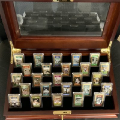 Tottenham Famous Moments Wooden Display Box: Named Golden Games Ingot Collection. Quality hinged wooden box with glass top. On display are the full set of 25 famous moments in their history in the form of a gold coloured ingot to one side and the golden moment to the other. Most would not have seen this before as expensive to buy originally. Attractive item and ideal gift. Layered with 24 carat gold it claims. Spare key for box included.